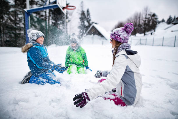 istock Kids having winter fun on playing field 1191235367
