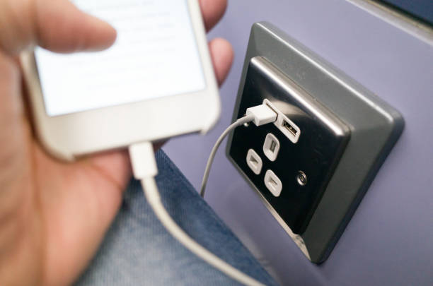 Charging Mobile Phone While Traveling stock photo