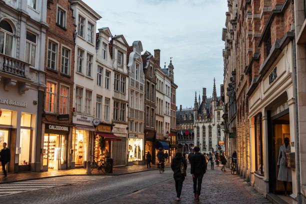 Shopping street in Bruges at dawn stock photo