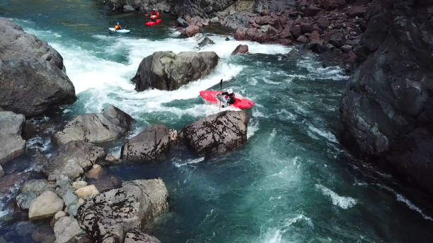istock White water kayaker paddles down river to meet friends 1191239907