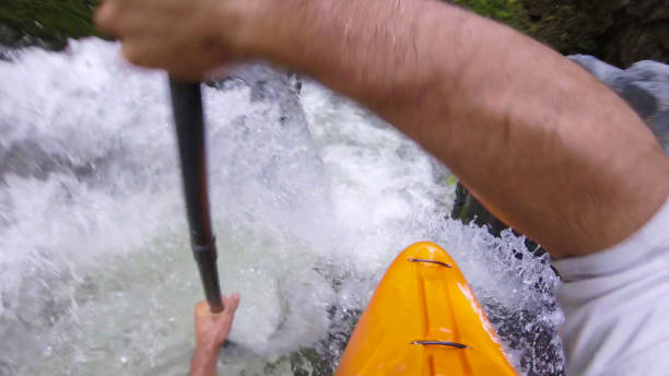 istock White water kayaker paddles down waterfall 1191240243