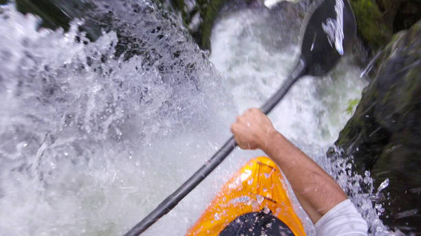 istock White water kayaker paddles down waterfall 1191240246