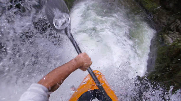 istock White water kayaker paddles down waterfall 1191240336