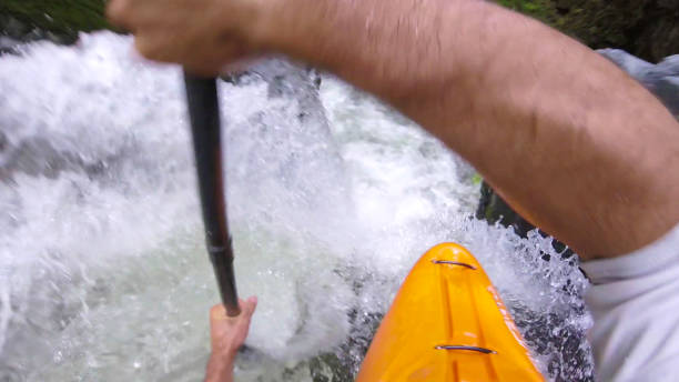 istock White water kayaker paddles down waterfall 1191240337