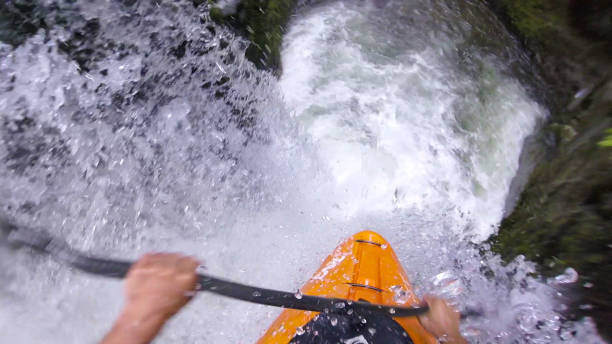istock White water kayaker paddles down waterfall 1191240345