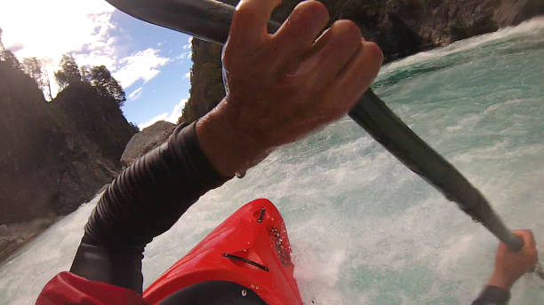 istock White water kayaker paddles down river 1191240438