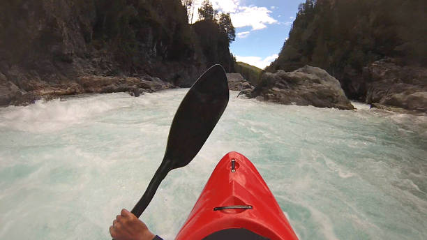 istock White water kayaker paddles down river 1191240572