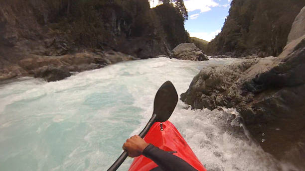 istock White water kayaker paddles down river 1191241093