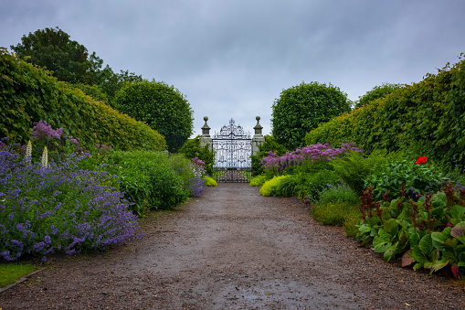 Sutherland, Scotland/UK - June 25, 2019: The gardens of Dunrobin Castle, a stately home in Sutherland, in the Scottish Highlands along of the North-Coast-500 on an overcast day.