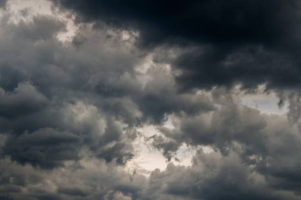 grey incoming storm clouds dark closeup backdrop grey incoming storm clouds dark closeup backdrop, captured with normal lens storm cloud sky dramatic sky cloud stock pictures, royalty-free photos & images