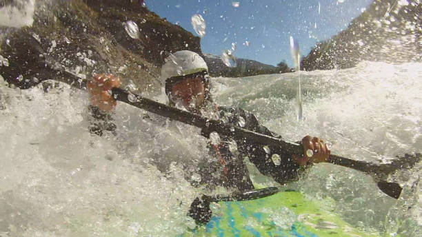 istock White water kayaker paddles down turbulent river 1191241439