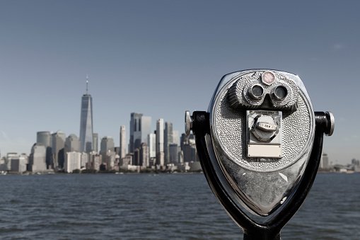 Binoculars with Lower Manhattan skyline in the city of New York