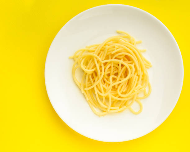 istock pasta, spaghetti or bucatini (ingredients, serving portion of food ). menu concept. food background. copy space. Top view 1191242736