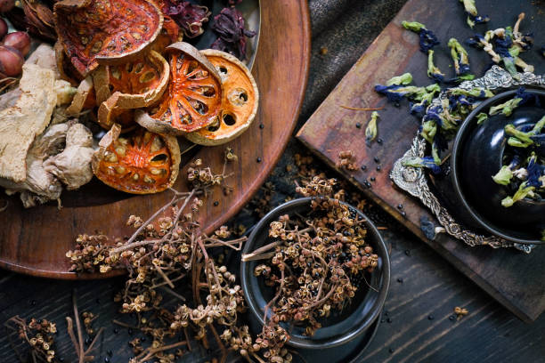 istock Spice and herbs. Dried herbs flat lay with selective focus on bael fruits. Rustic concept. 1191243875