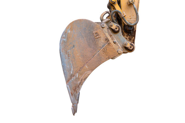 Yellow excavator bucket on blue sky background