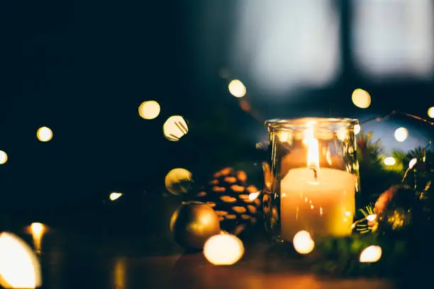Photo of Christmas mood at home with candle and lights