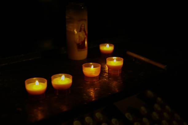 istock View on isolated candles in catholic church 1191249036