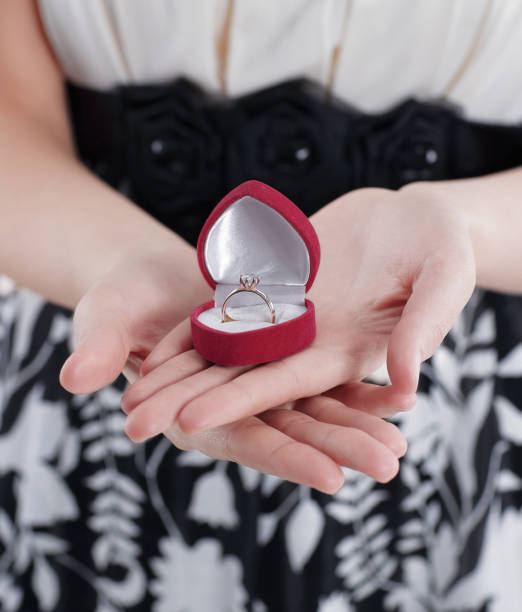 istock young woman holding gift on Valentine's day. 1191249126
