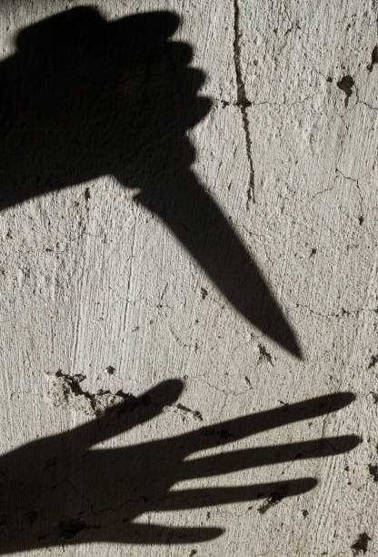 istock Shadows. Criminal and victim. 1191249391