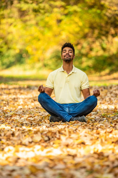 istock Young man taking a break in nature and meditating. 1191250855