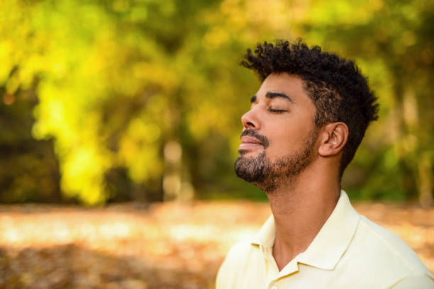 istock Young man meditating in nature on autumn day. 1191251549