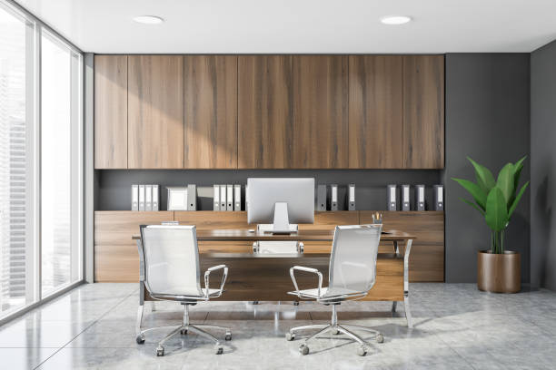 istock Stylish gray and wooden CEO office interior 1191251616