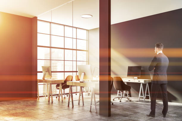istock Businessman in luxury gray office 1191253132