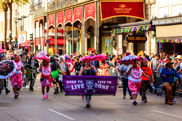 The  Live Bone Group  -  New Orleans New Orleans USA Feb 1, 2019: Mardi Gras parades through the streets of New Orleans. People celebrated crazily. Mardi Gras is the biggest celebration the city of New Orleans hosts every year. new orleans mardi gras stock pictures, royalty-free photos & images