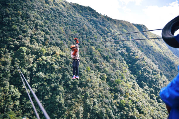 istock Girl Zip lining in the mountains 1191254595