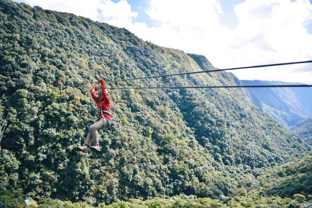 istock Woman Zip lining in the mountains 1191255775