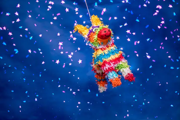 Mexican piñata party hanging blue and green background with bright multicolored celebrating birthday, Christmas, party, party songs, star and donkey figure, family fun