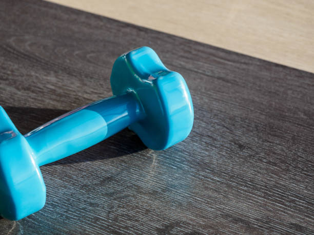 istock Blue dumbbell on the floor in the gym 1191257115