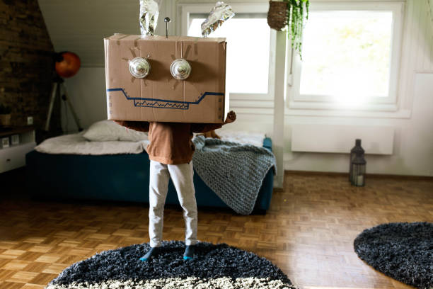 istock Small kid pretending to be a robot at home. 1191257325