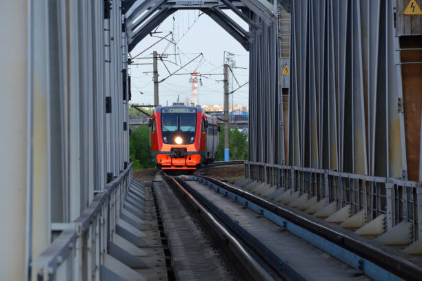 istock Commuter diesel-electric train passes the steel bridge 1191258741