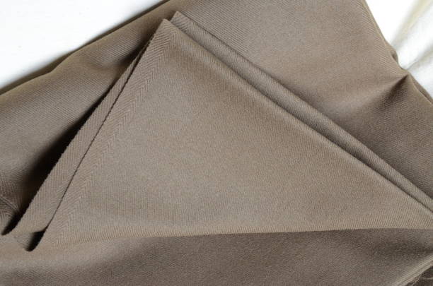 istock Brown-green high quality textile with the unfolded edge 1191259056