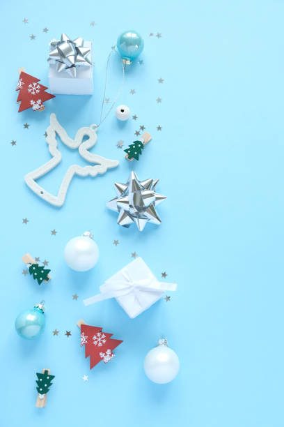 istock Christmas background with decorations and gift boxes on blue background 1191261694