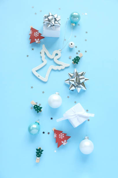 istock Christmas background with decorations and gift boxes on blue background 1191261704