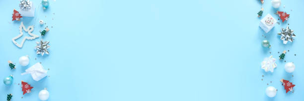 istock Christmas background with decorations and gift boxes on blue background 1191261712
