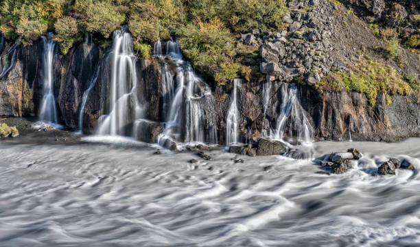 hraunfossar waterfall in Iceland volcanic lava waterfall of Hraunfossar in Iceland hraunfossar stock pictures, royalty-free photos & images