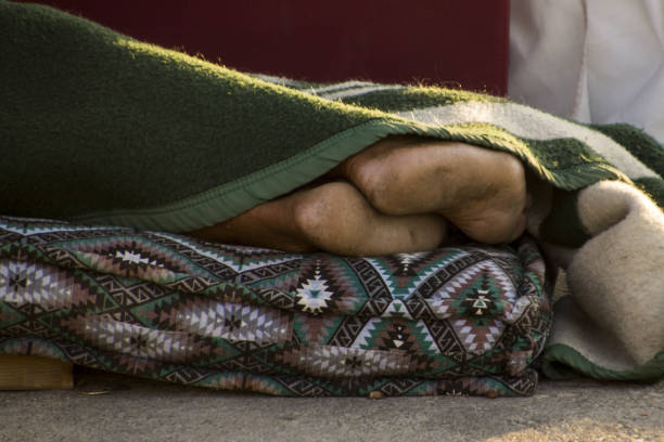 istock homeless sleeping on the street 1191263017