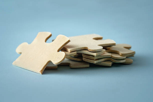 istock Wooden Jigzaw Puzzle on Blue Background 1191263172