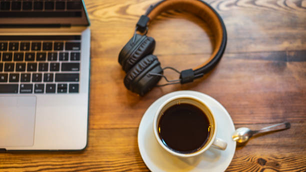 istock coffee and headphones, laptop 1191264352