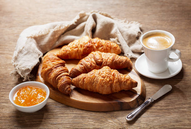 istock breakfast with cup of coffee, croissants and orange jam 1191264477