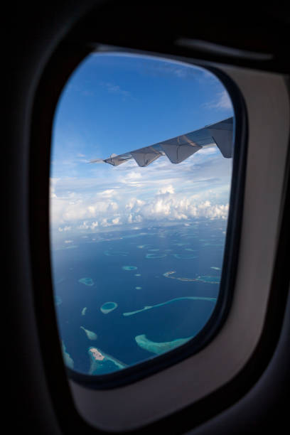 istock fyling over maldives islands 1191265447