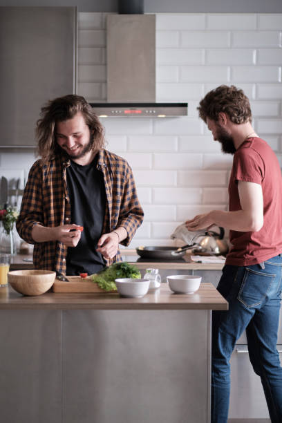 istock Two friends cook together in the kitchen. 1191265638