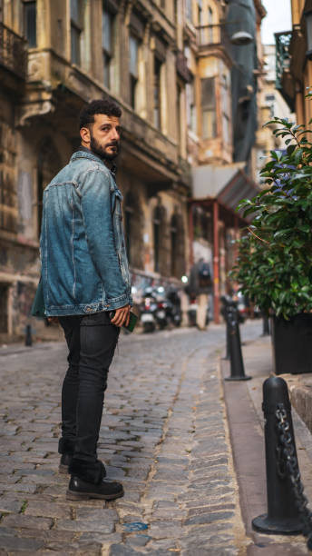 istock men on the street with computer/istanbul 1191265717
