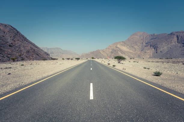 istock straight through the al-hajar mountains in oman 1191265740