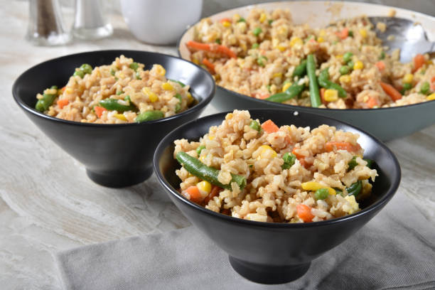 Fresh cooked fried rice Fried rice with egg and vegetables chinese cuisine fried rice asian cuisine wok stock pictures, royalty-free photos & images