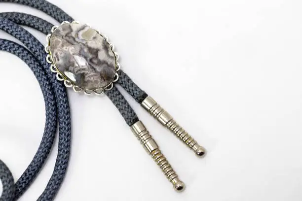 Stone and Silver Bolo tie on a white background