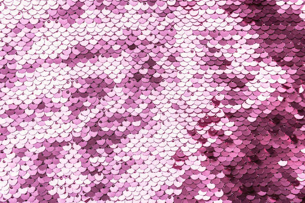 istock Pink purple shiny fabric with sequins, abstract background. 1191268143